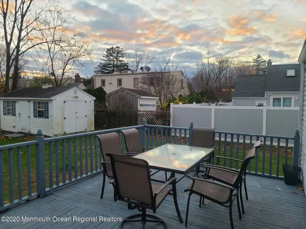a view of a chairs and table on the deck
