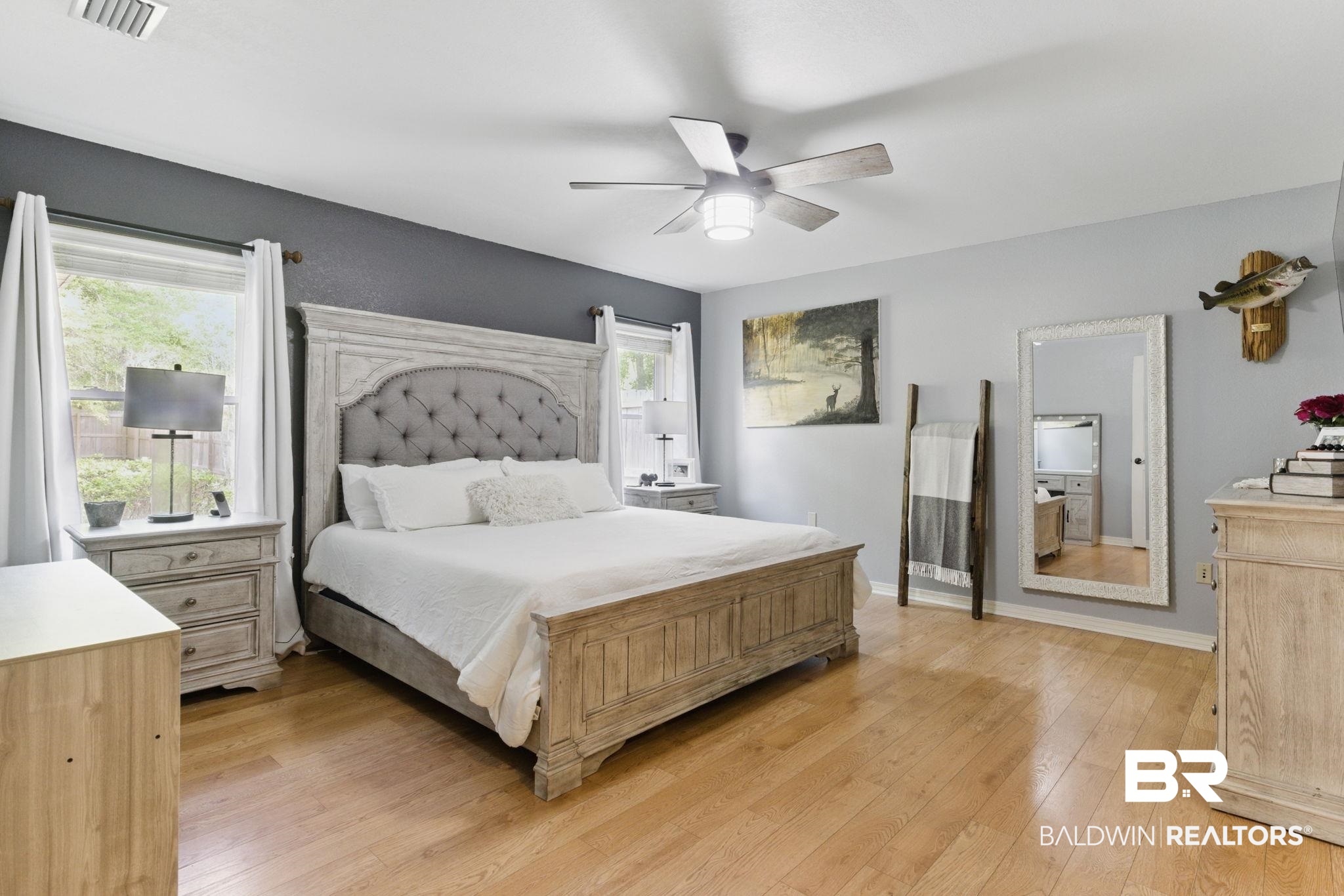 32345 River Lake Road Seminole, AL 36574 - Photo 25 of 56 Bedroom featuring visible vents, baseboards, a ceiling fan, and light wood-style floors