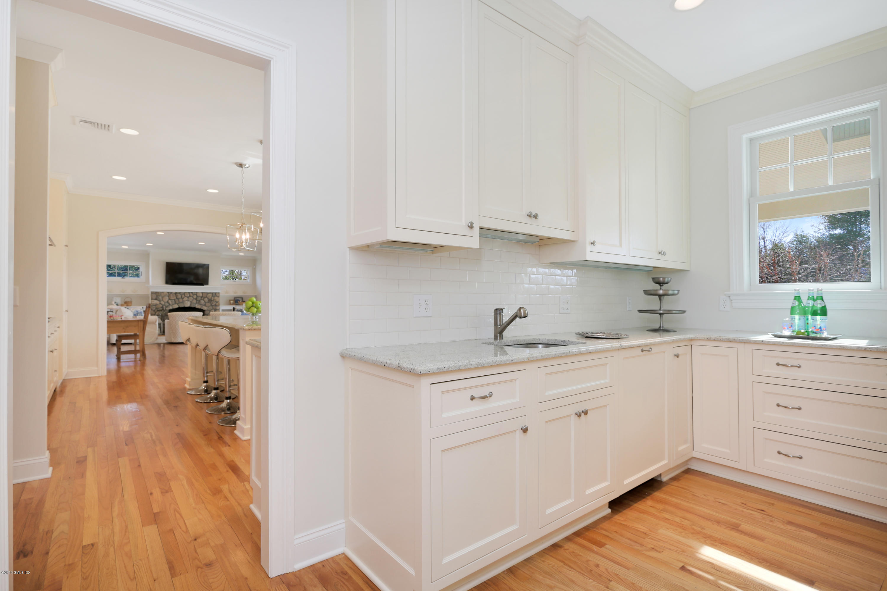 4 Highgate Road Riverside, CT 06878 - Photo 13 of 33 a kitchen with white cabinets and sink
