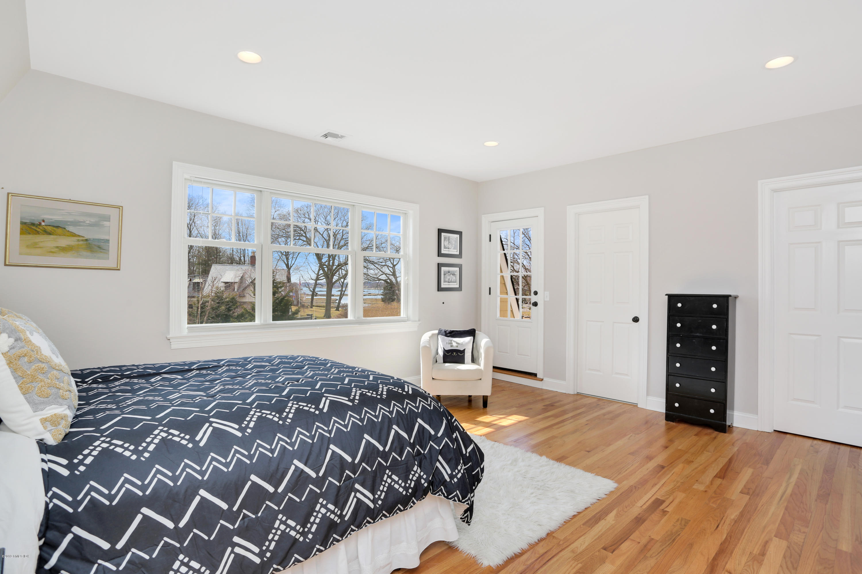 4 Highgate Road Riverside, CT 06878 - Photo 21 of 33 a bedroom with a bed and wooden floor