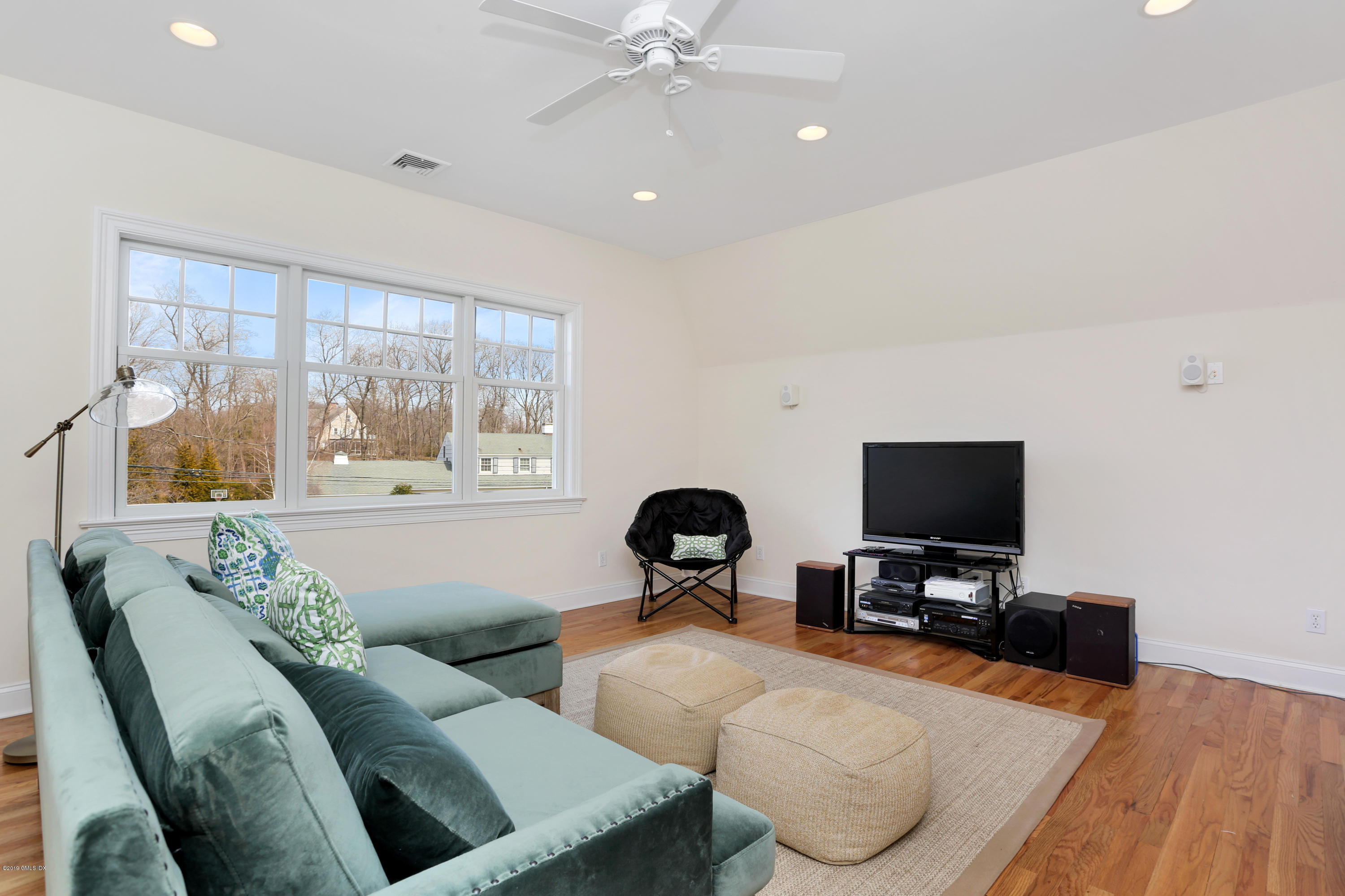 4 Highgate Road Riverside, CT 06878 - Photo 22 of 33 a living room with furniture and a flat screen tv