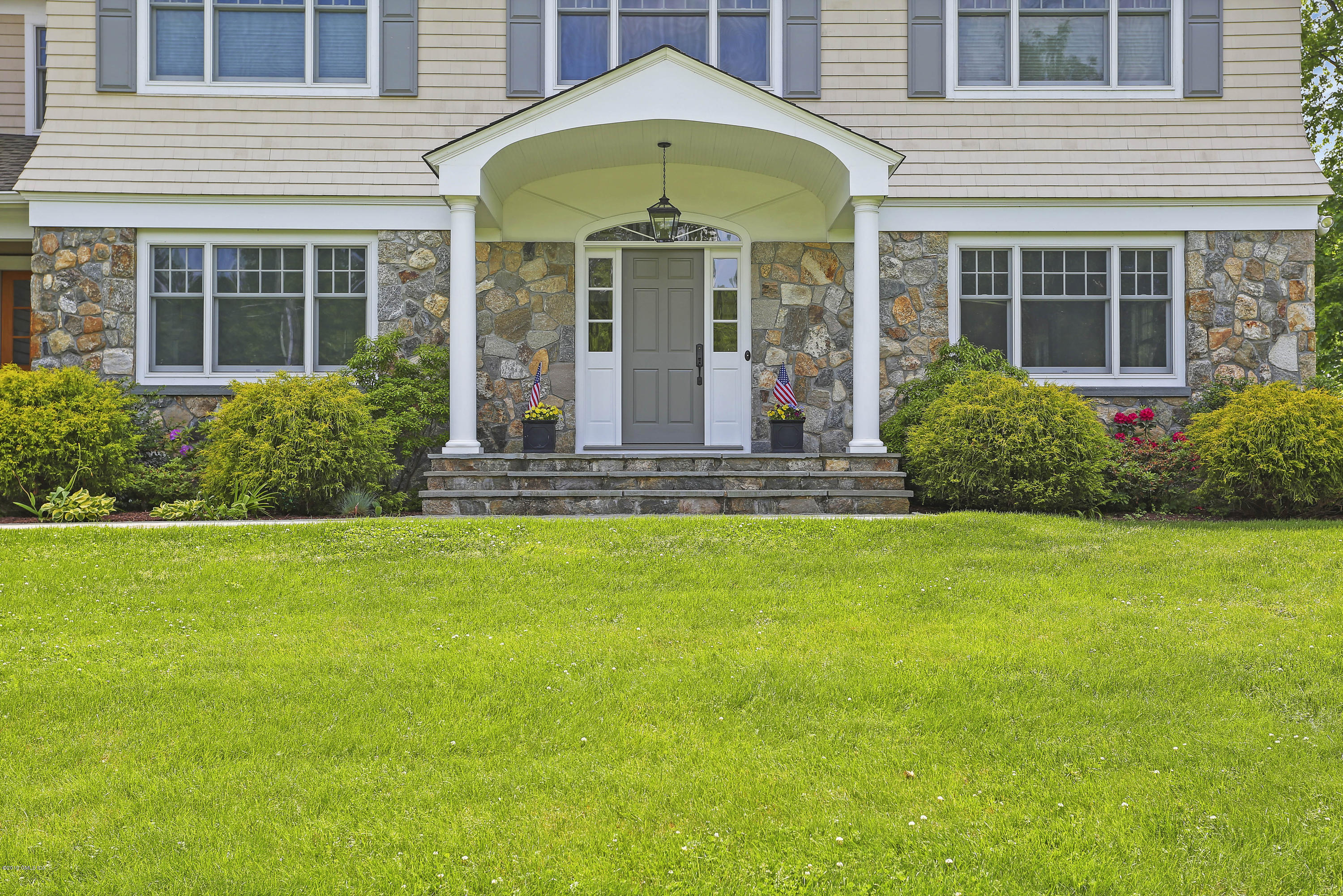 4 Highgate Road Riverside, CT 06878 - Photo 29 of 33 a front view of a house with garden