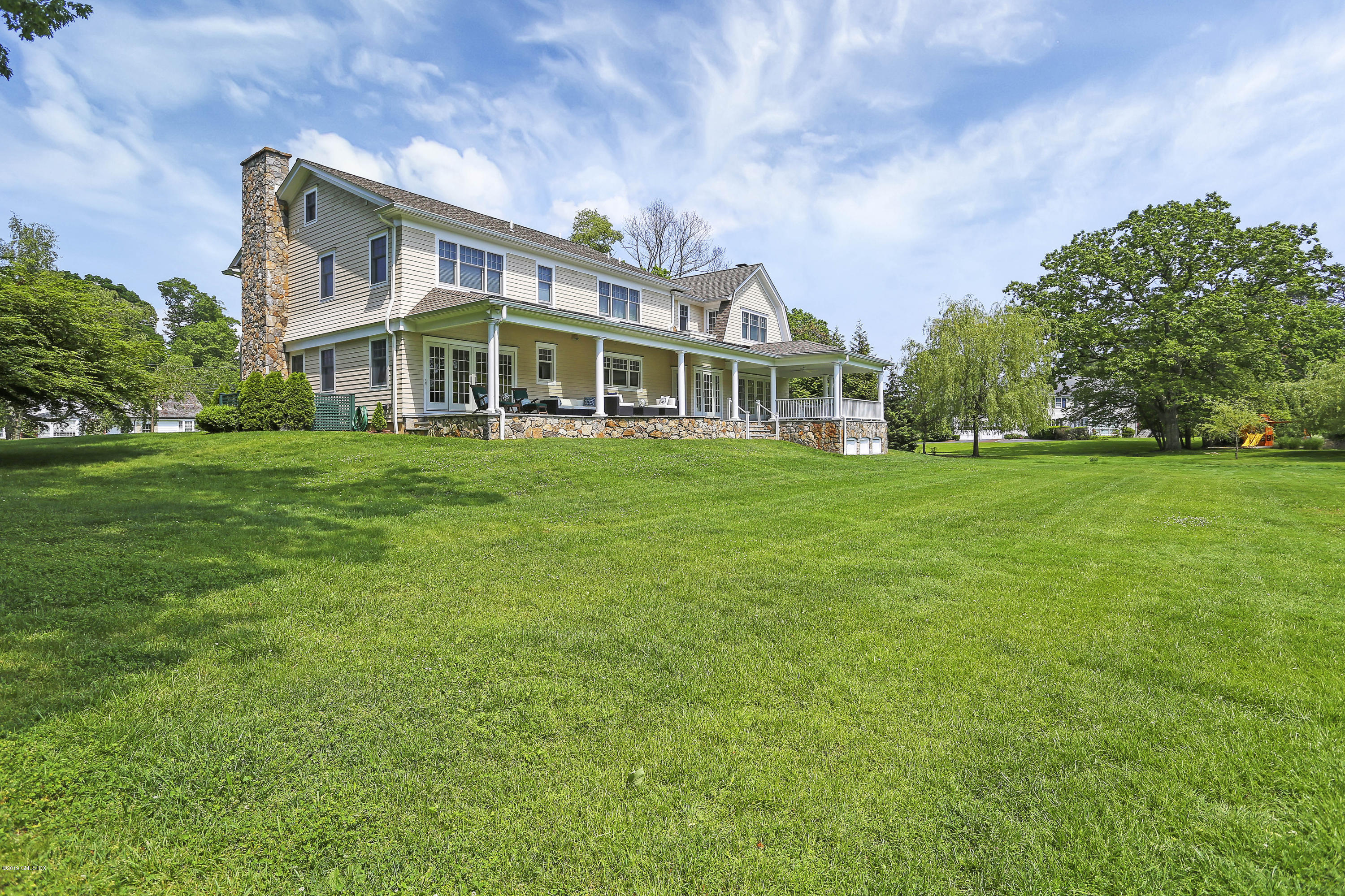4 Highgate Road Riverside, CT 06878 - Photo 30 of 33 a front view of a house with a garden