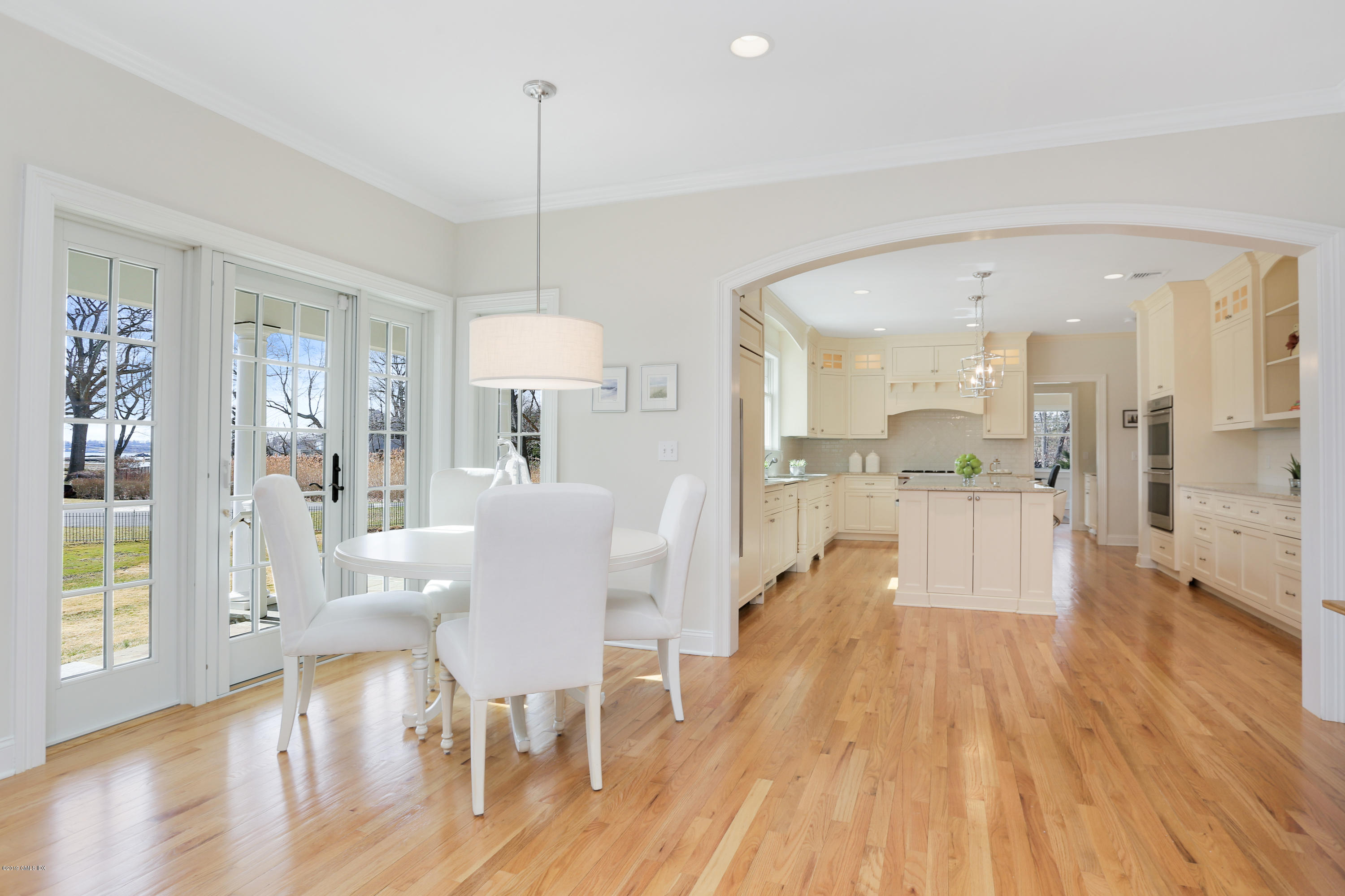 4 Highgate Road Riverside, CT 06878 - Photo 6 of 33 a view of a dining room and livingroom with furniture wooden floor a chandelier