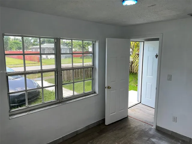 a view of a room that has a large window