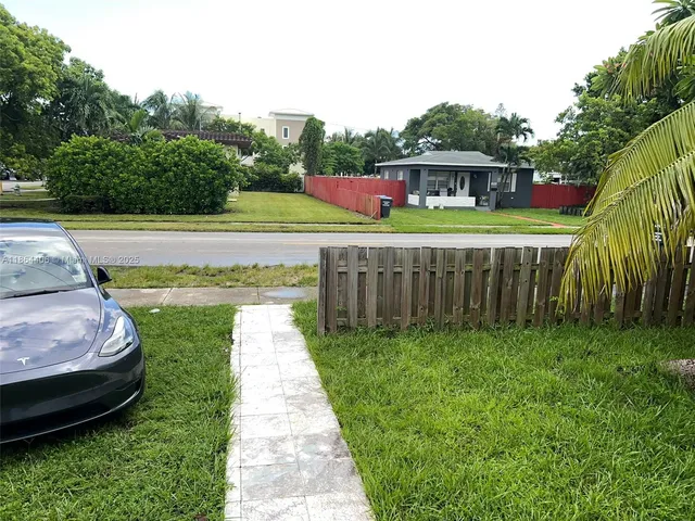 a view of a backyard with a garden