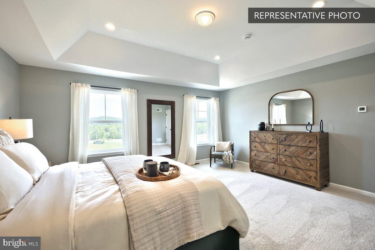 57 Sajer Road Pottsville, PA 17901 - Photo 18 of 22 a bedroom with a bed and dresser with mirror