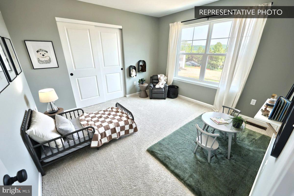 57 Sajer Road Pottsville, PA 17901 - Photo 22 of 22 a bedroom with furniture and a large window