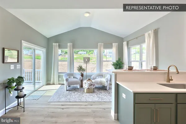 a living room with furniture and window