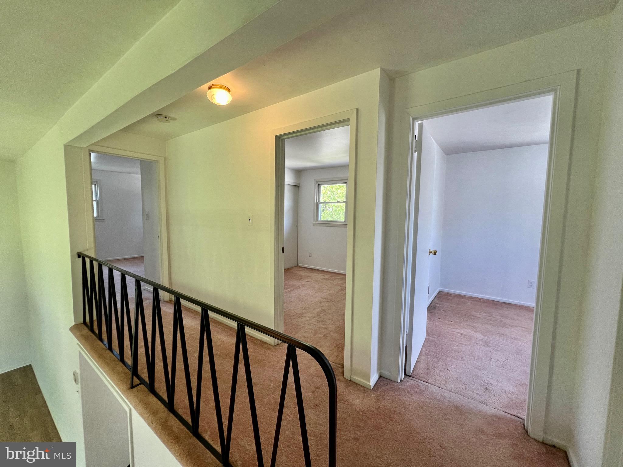 158 Brookside Boulevard Newark, DE 19713 - Photo 21 of 27 a view of a hallway with wooden floor and stairs