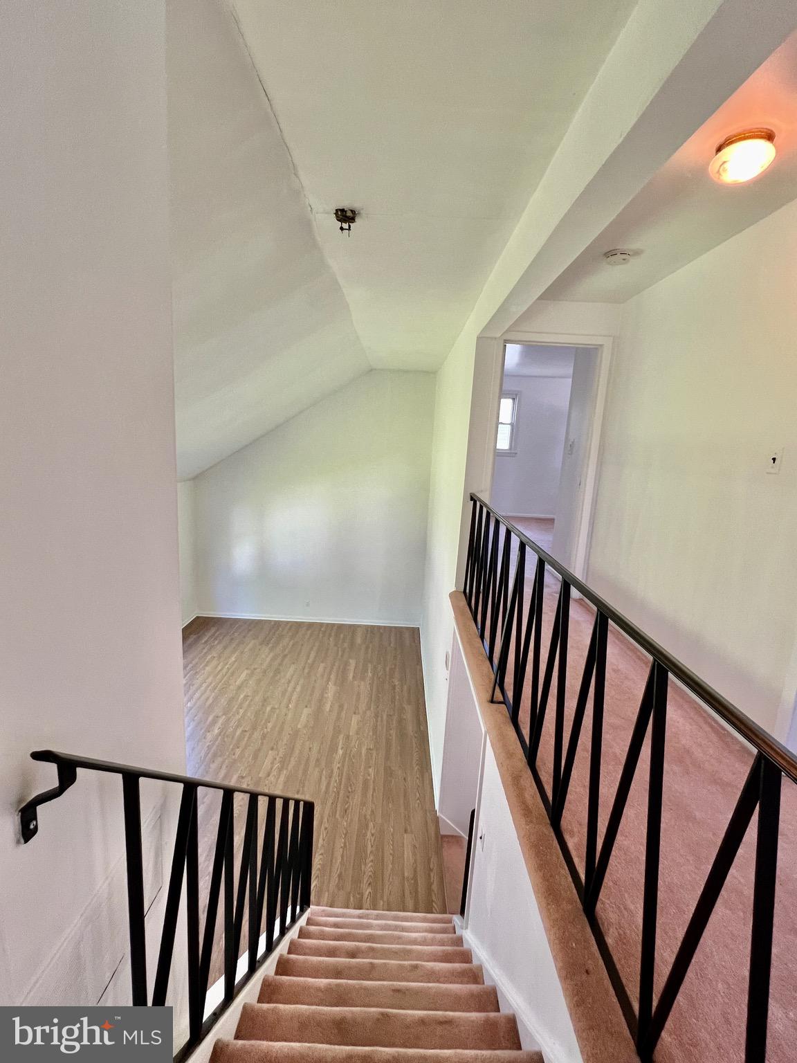 158 Brookside Boulevard Newark, DE 19713 - Photo 22 of 27 a view of staircase with lots of frames on wall and wooden floor