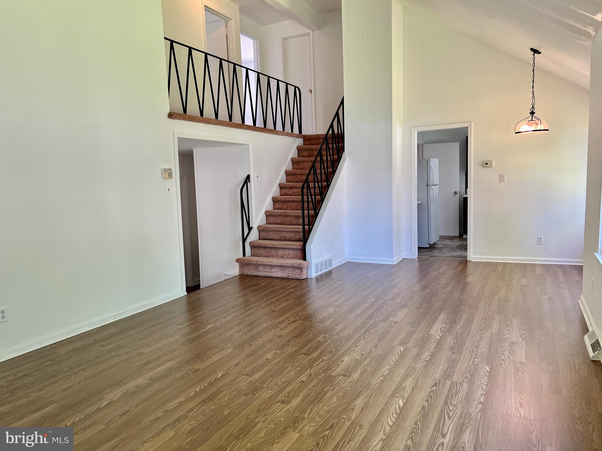 158 Brookside Boulevard Newark, DE 19713 - Photo 5 of 27 a view of a hallway with wooden floor and staircase