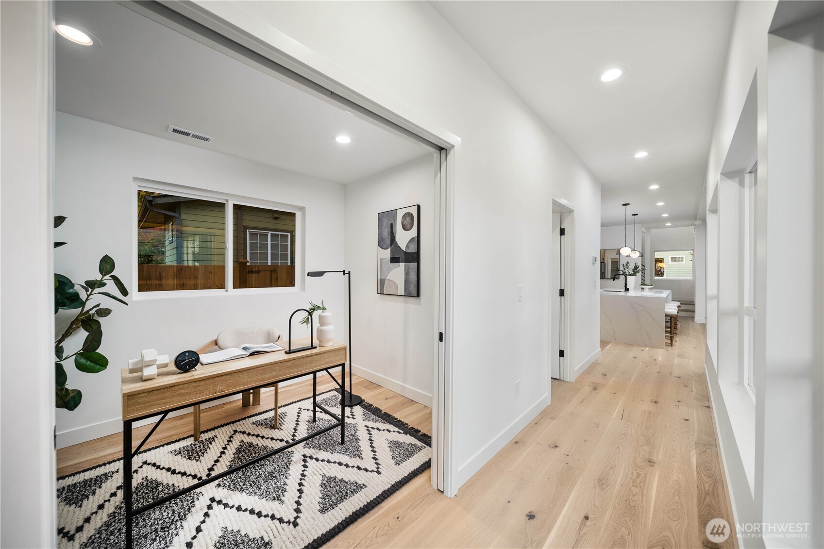 511 Morris Avenue South Renton, WA 98057 - Photo 23 of 40 a view of a hallway with wooden floor and windows