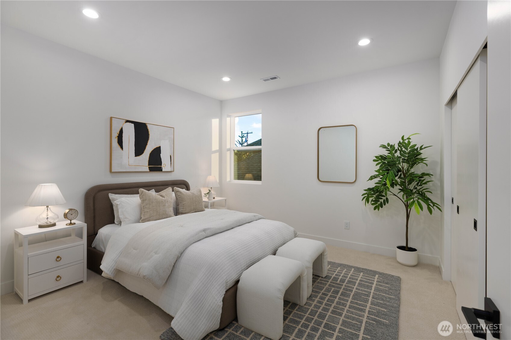 511 Morris Avenue South Renton, WA 98057 - Photo 30 of 40 a bedroom with a bed and a potted plant