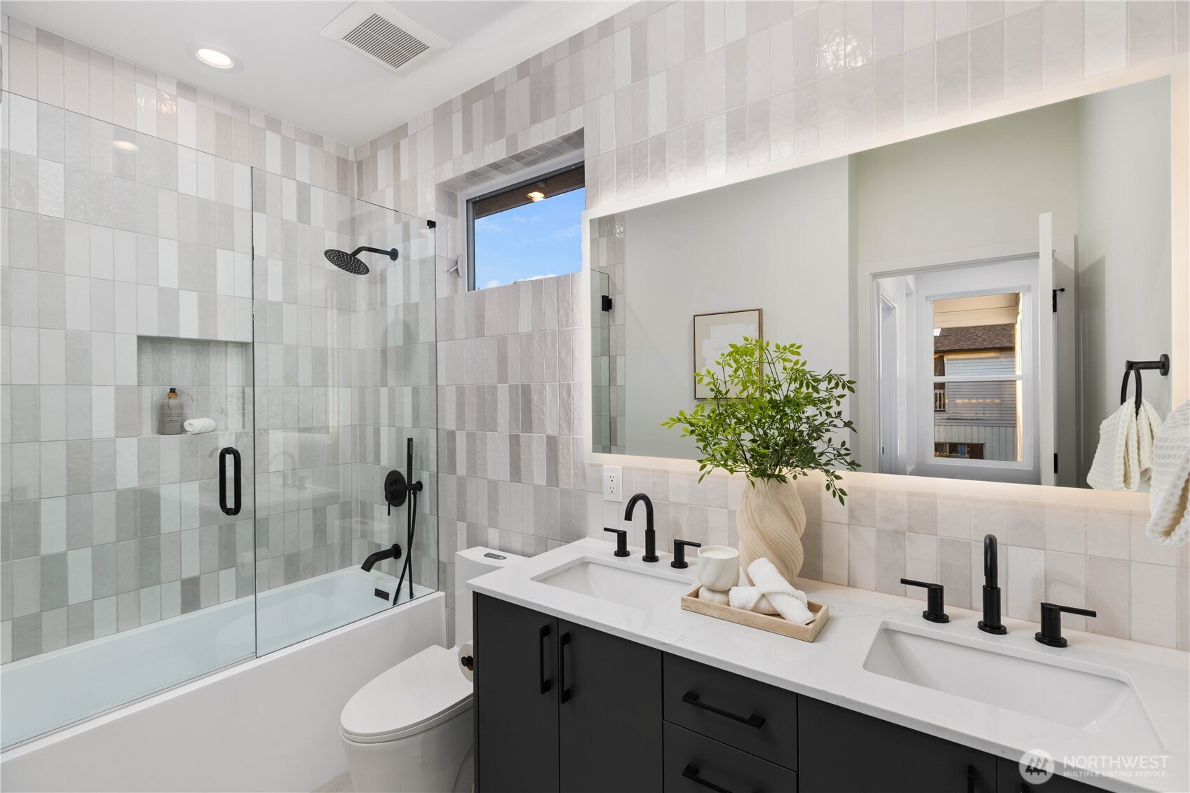 511 Morris Avenue South Renton, WA 98057 - Photo 31 of 40 a bathroom with a sink a toilet and shower