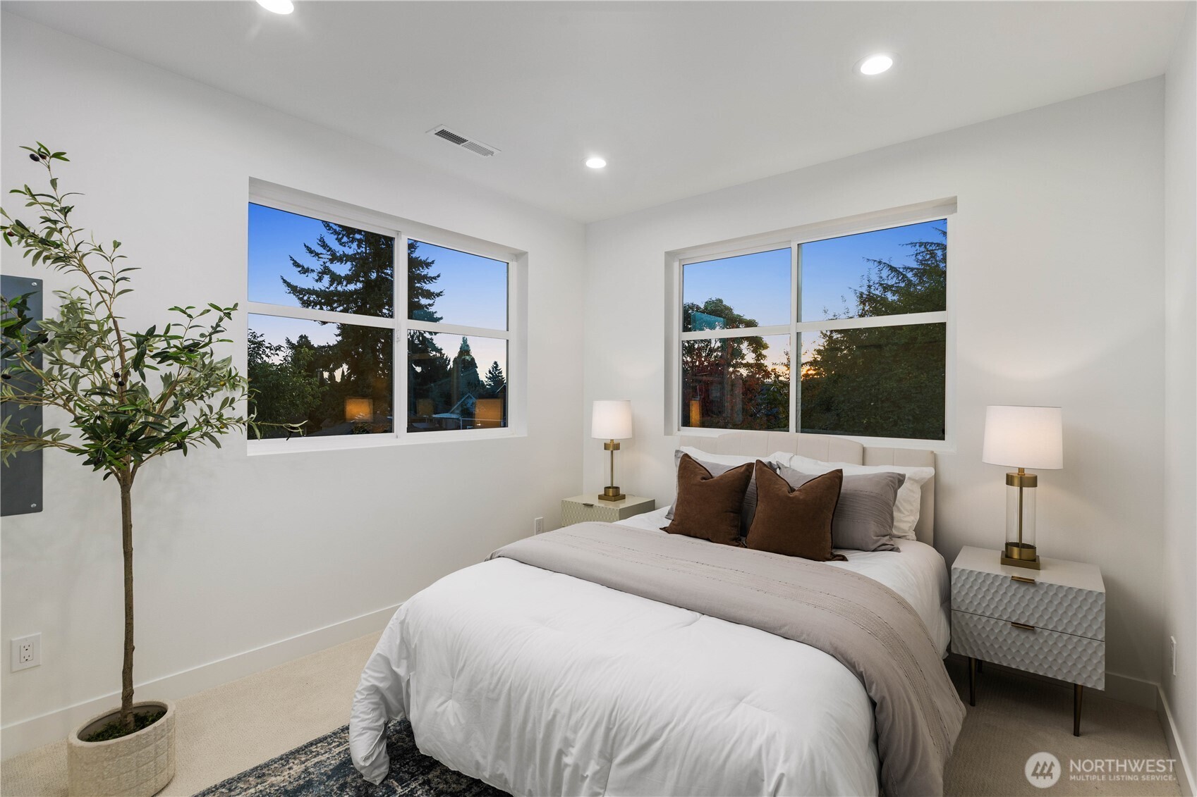 511 Morris Avenue South Renton, WA 98057 - Photo 38 of 40 a bedroom with a large bed and a potted plant