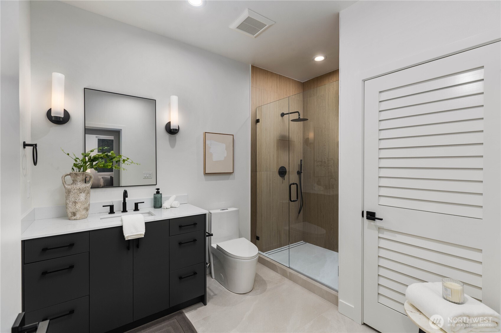 511 Morris Avenue South Renton, WA 98057 - Photo 39 of 40 a bathroom with a double vanity sink toilet mirror and shower