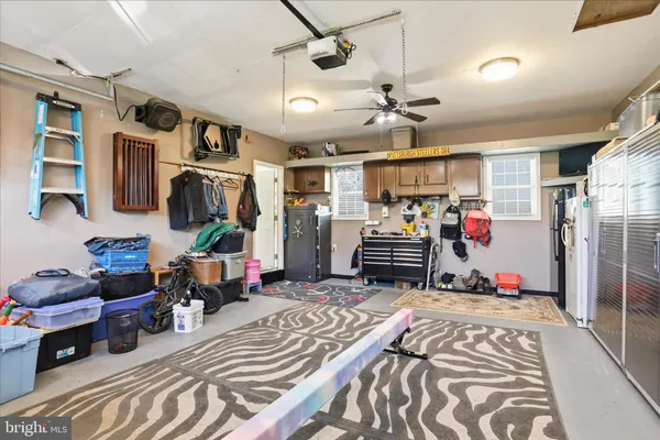 a bedroom with a bed and a large mirror