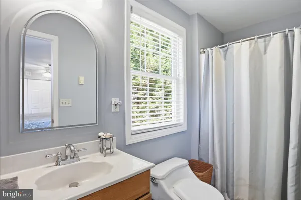 a view of a swimming pool with a patio and a tub