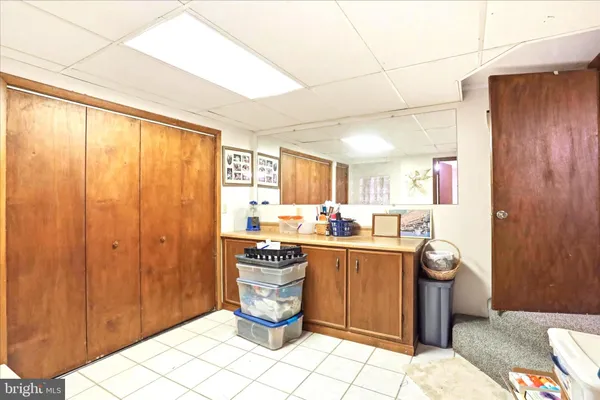 a kitchen with granite countertop cabinets stainless steel appliances and a counter space