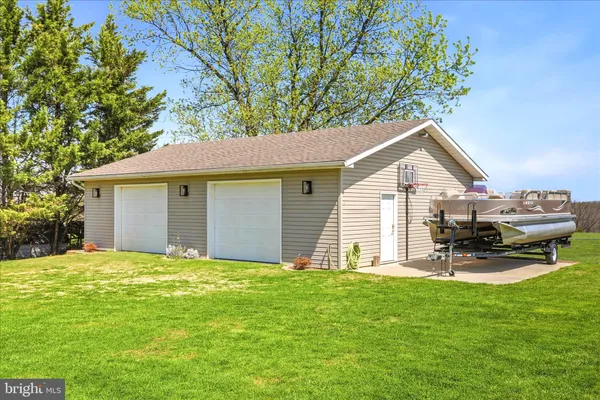 a view of a house with a yard and sitting area
