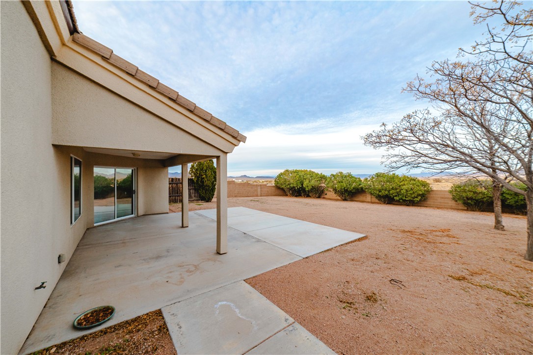 3374 Roma Road Kingman, AZ 86401 - Photo 59 of 64 Fenced backyard featuring a patio area