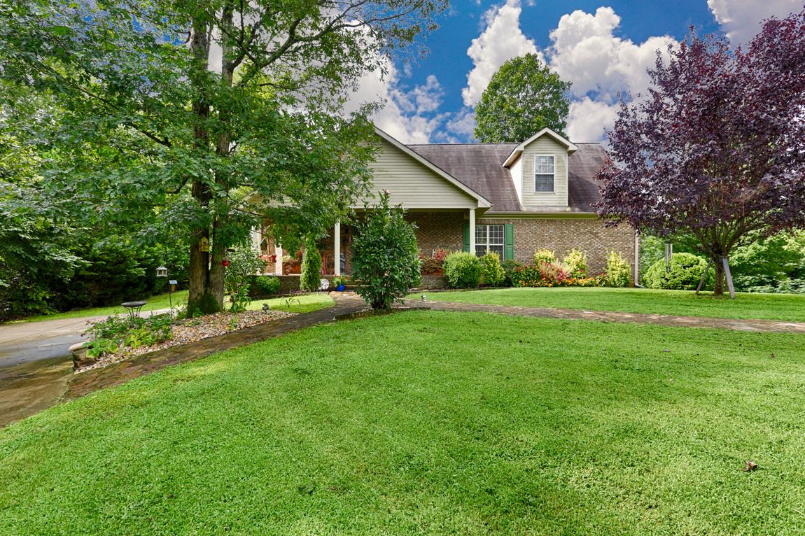 1690 Alf Harris Road Prospect, TN 38477 - Photo 1 of 30 a house view with a garden space