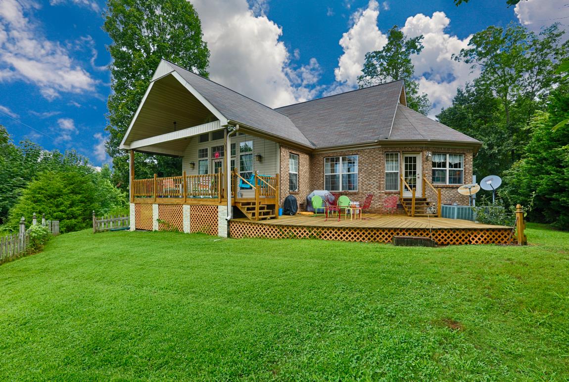 1690 Alf Harris Road Prospect, TN 38477 - Photo 2 of 30 a front view of a house with garden