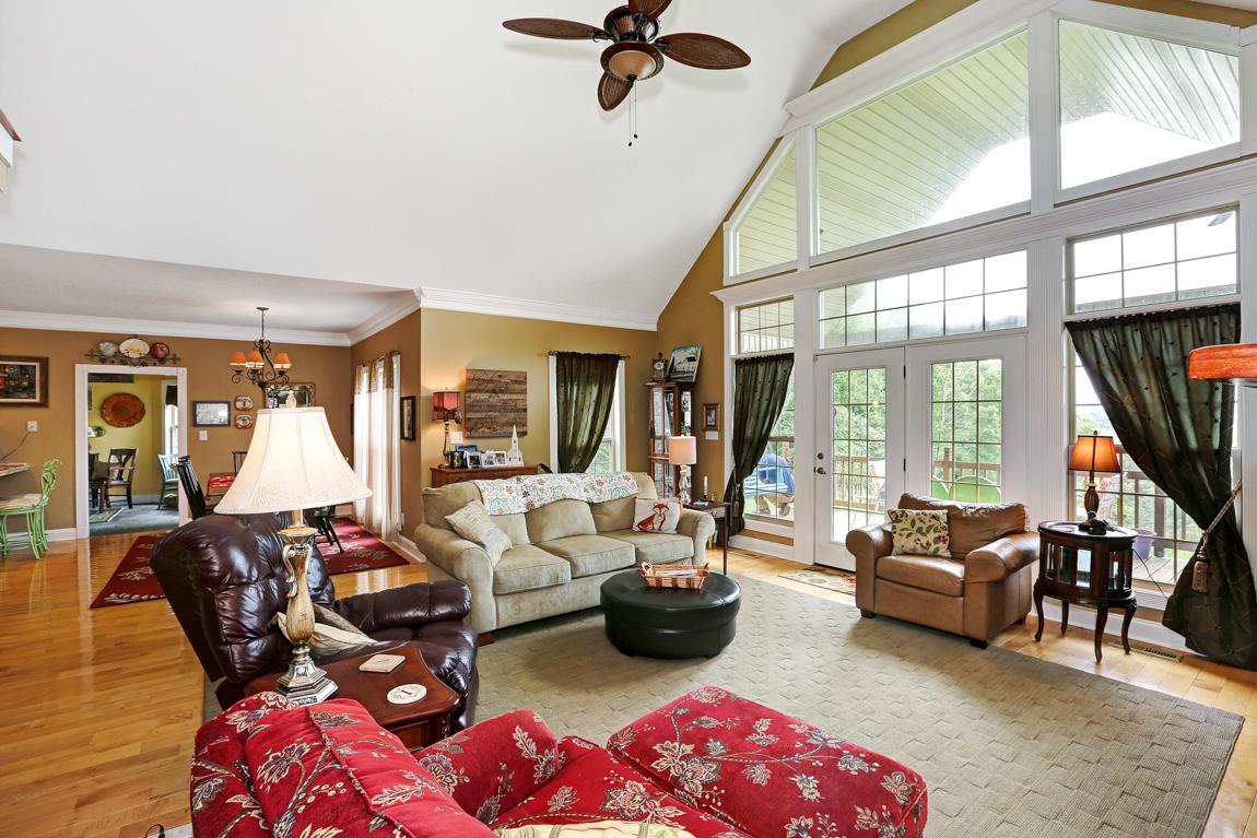 1690 Alf Harris Road Prospect, TN 38477 - Photo 11 of 30 a living room with furniture fireplace and a large window