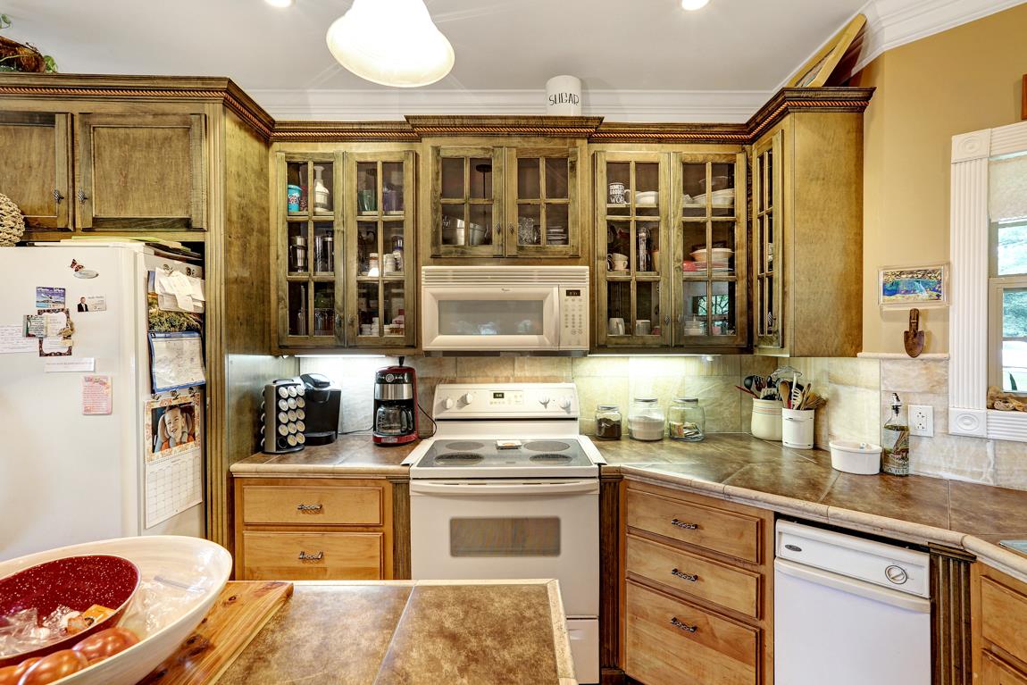 1690 Alf Harris Road Prospect, TN 38477 - Photo 15 of 30 a kitchen with stainless steel appliances a stove a sink and a refrigerator