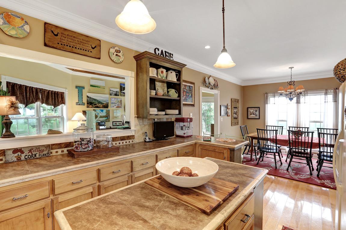 1690 Alf Harris Road Prospect, TN 38477 - Photo 16 of 30 a large kitchen with a table and chairs