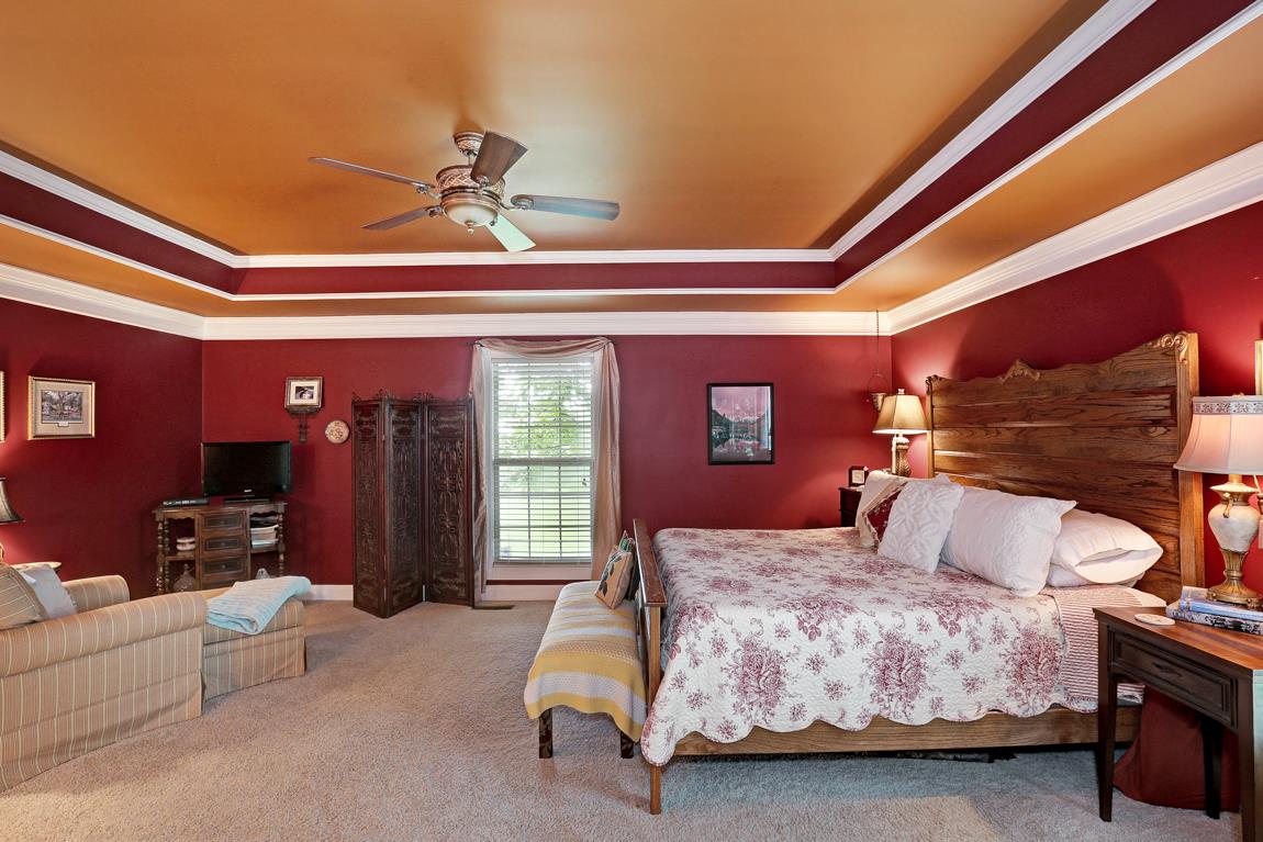 1690 Alf Harris Road Prospect, TN 38477 - Photo 19 of 30 a bedroom with a bed couch and dresser