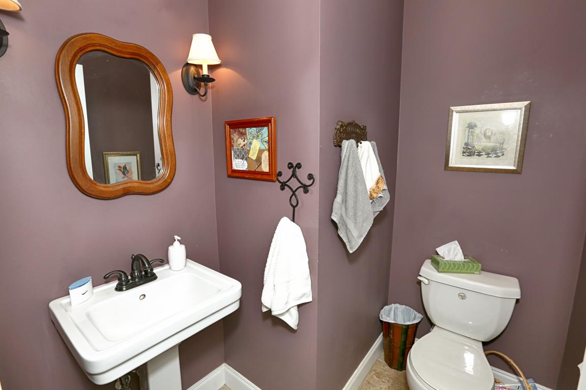 1690 Alf Harris Road Prospect, TN 38477 - Photo 24 of 30 a bathroom with a toilet sink and mirror