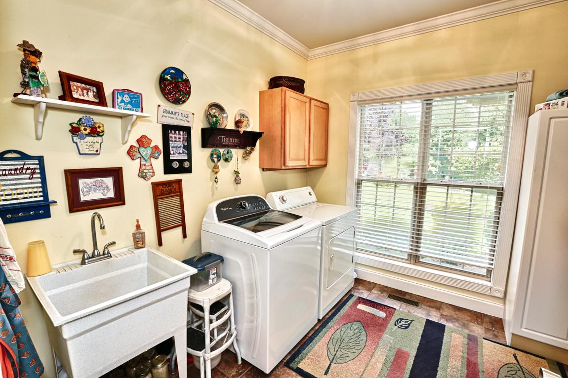 1690 Alf Harris Road Prospect, TN 38477 - Photo 30 of 30 a utility room with dryer and washer