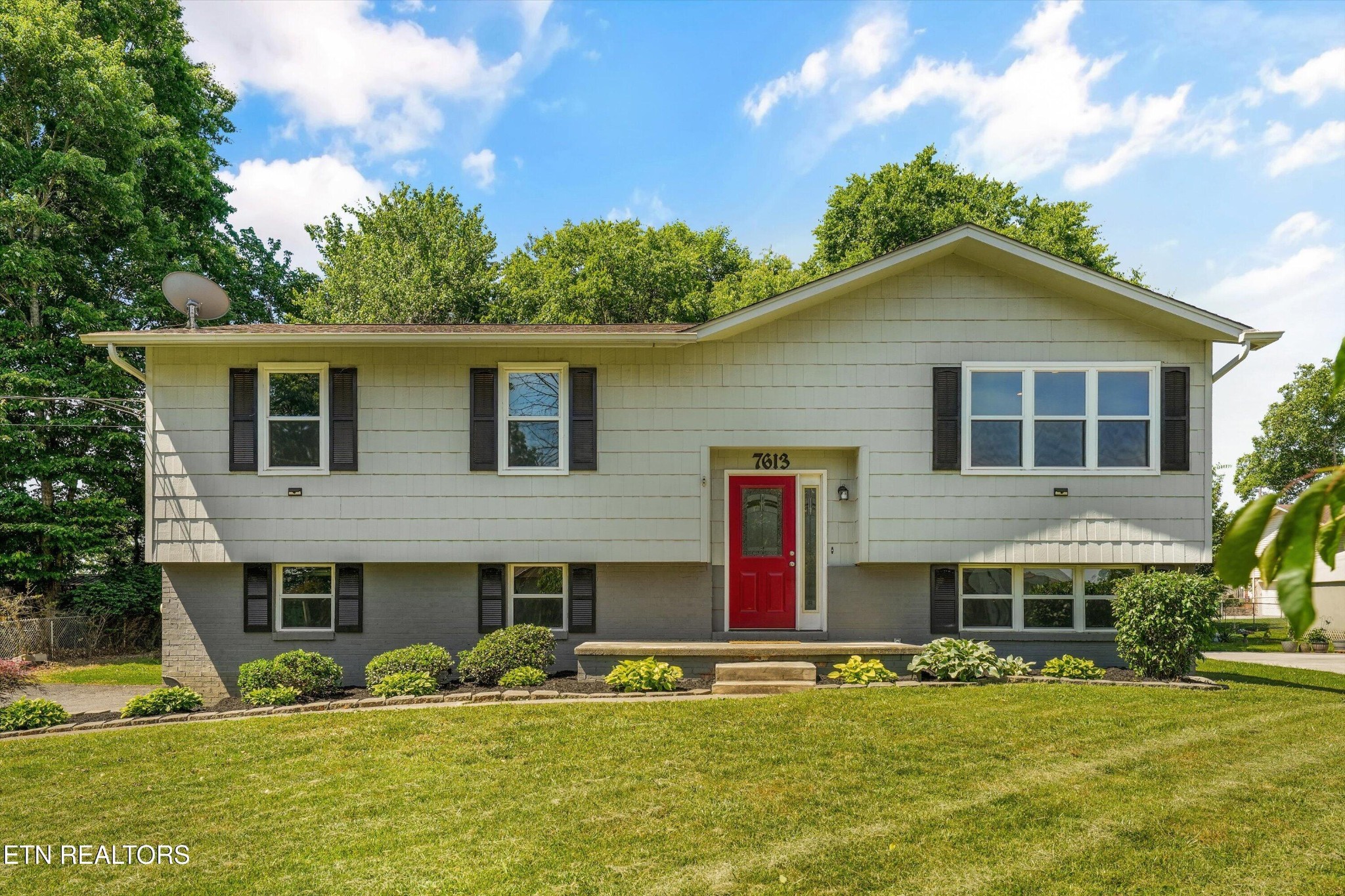 7613 Fall Wind Court Powell, TN 37849 - Photo 2 of 38 a front view of house with yard