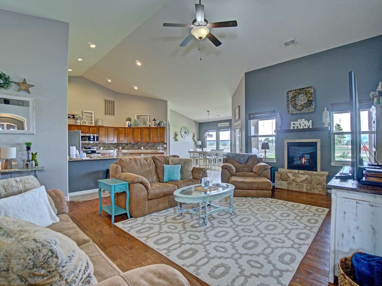 1171 Toscano Road Fruita, CO 81521 - Photo 11 of 27 a living room with furniture and a fireplace