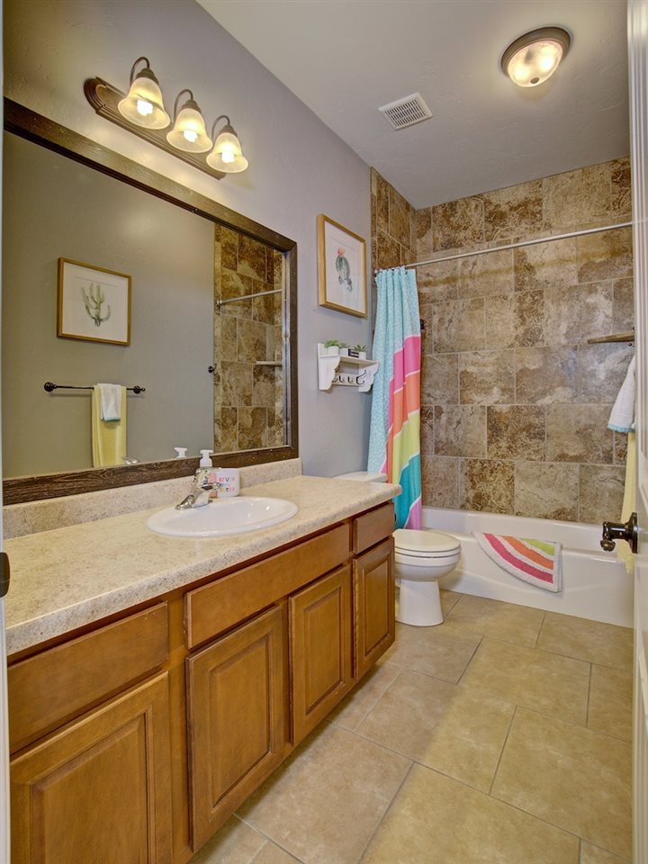 1171 Toscano Road Fruita, CO 81521 - Photo 18 of 27 a bathroom with a toilet sink and mirror
