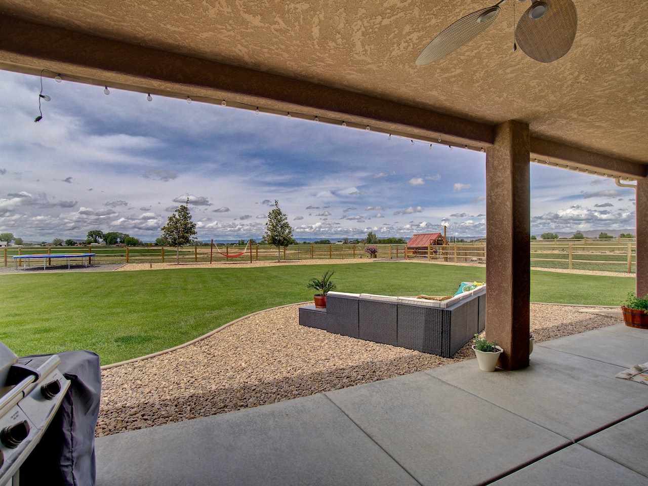 1171 Toscano Road Fruita, CO 81521 - Photo 2 of 27 a view of swimming pool from balcony with outdoor seating