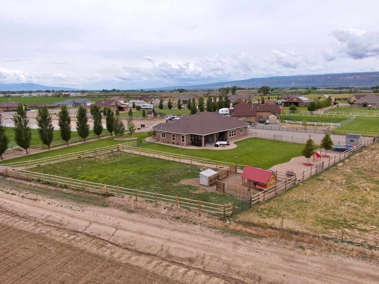 1171 Toscano Road Fruita, CO 81521 - Photo 24 of 27 an aerial view of a house with a yard