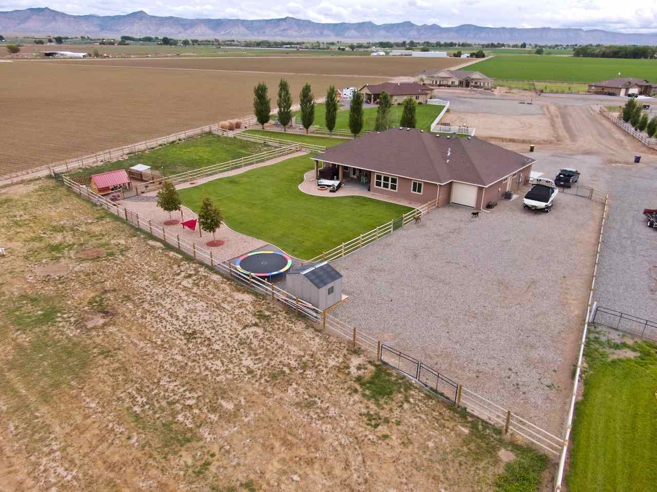 1171 Toscano Road Fruita, CO 81521 - Photo 26 of 27 a view of a lake with a mountain