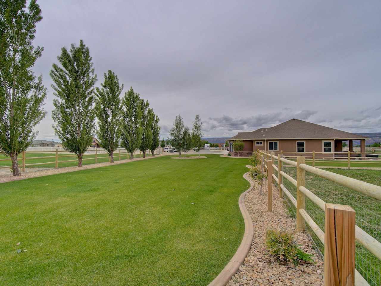 1171 Toscano Road Fruita, CO 81521 - Photo 5 of 27 a view of yard with swimming pool and green space
