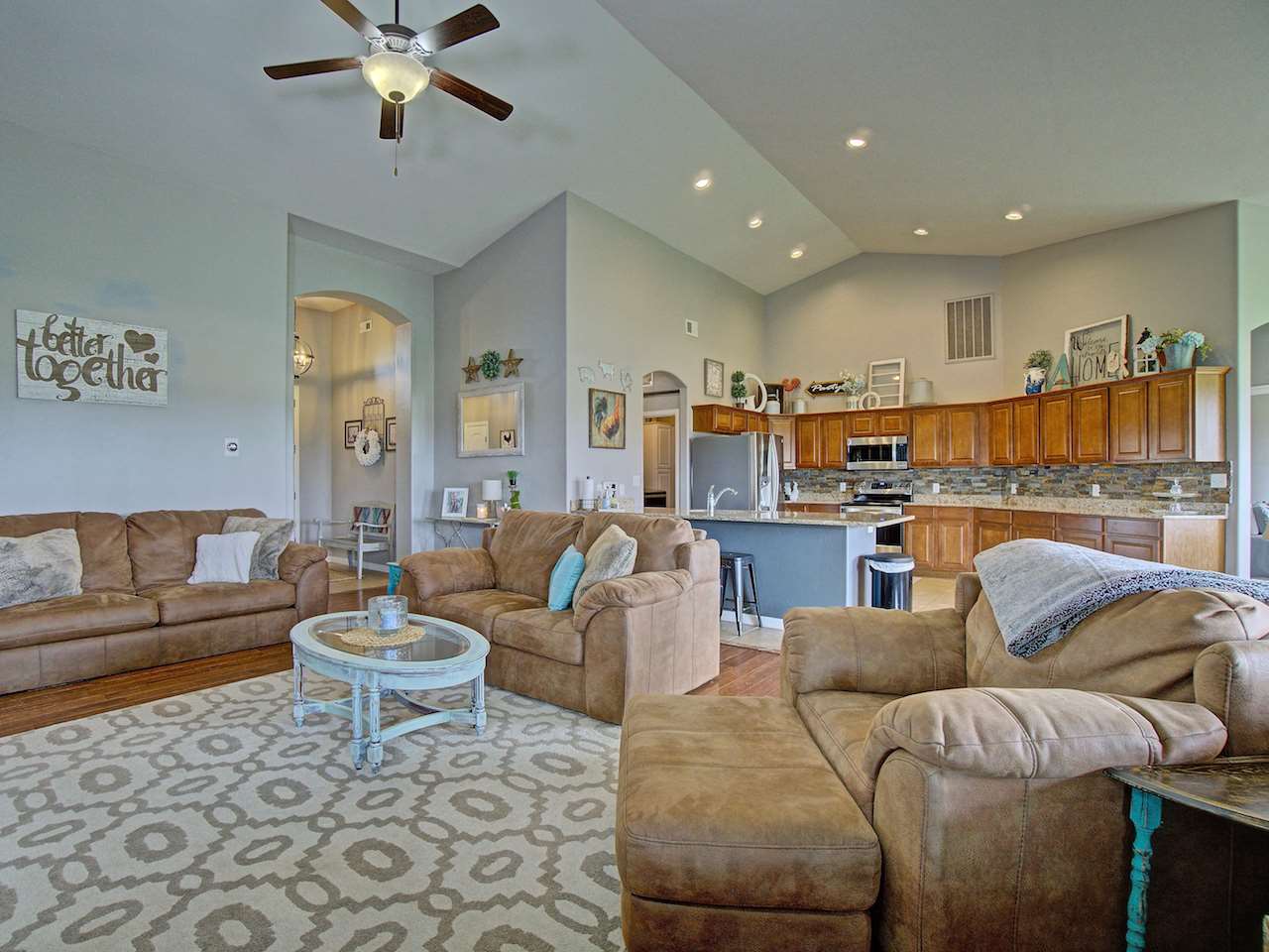 1171 Toscano Road Fruita, CO 81521 - Photo 9 of 27 a living room with furniture and a view of kitchen