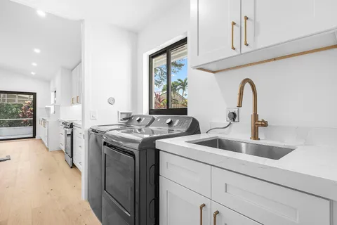 a view of a kitchen sink and a stove