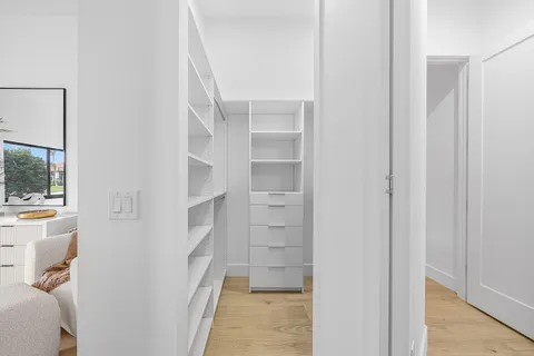 a bathroom with a glass shower door