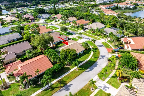 an aerial view of residential houses with outdoor space and street view