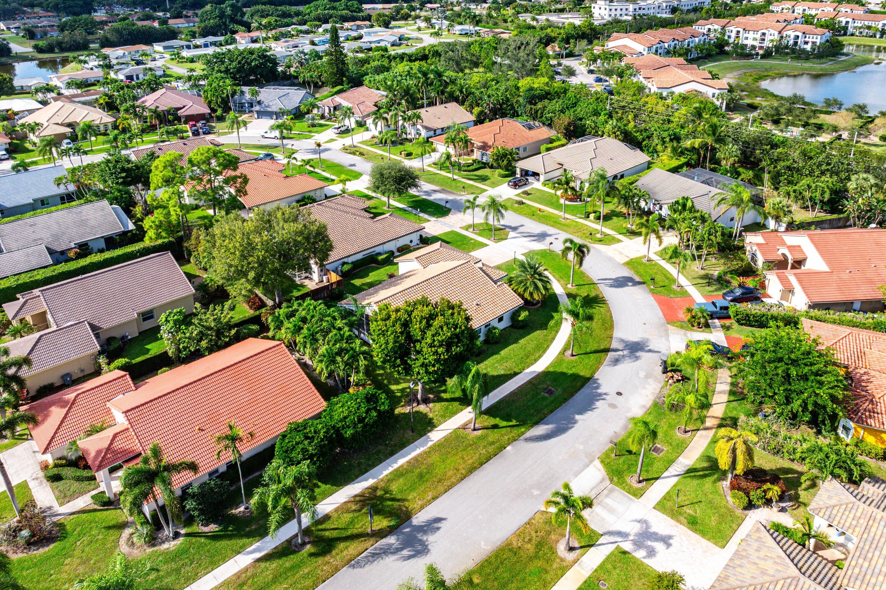 5723 Aspen Ridge Circle Delray Beach, FL 33484 - Photo 39 of 47 an aerial view of residential houses with outdoor space and street view