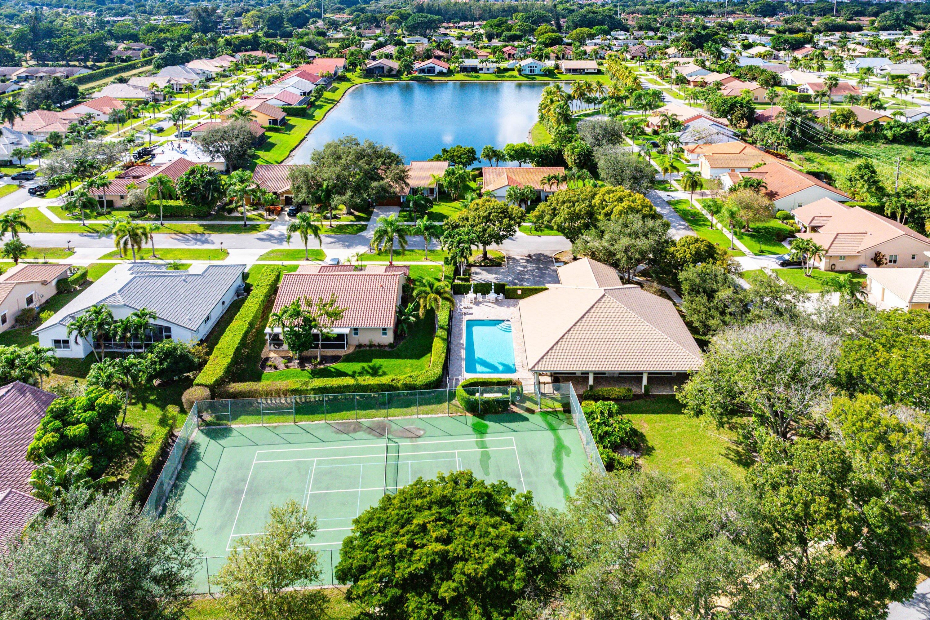 5723 Aspen Ridge Circle Delray Beach, FL 33484 - Photo 45 of 47 an aerial view of a house with a garden and swimming pool