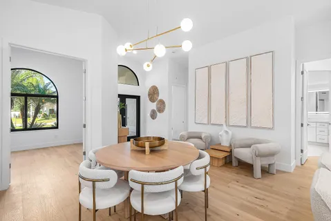 a living room with furniture a window and a table