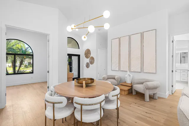 a living room with furniture a window and a table