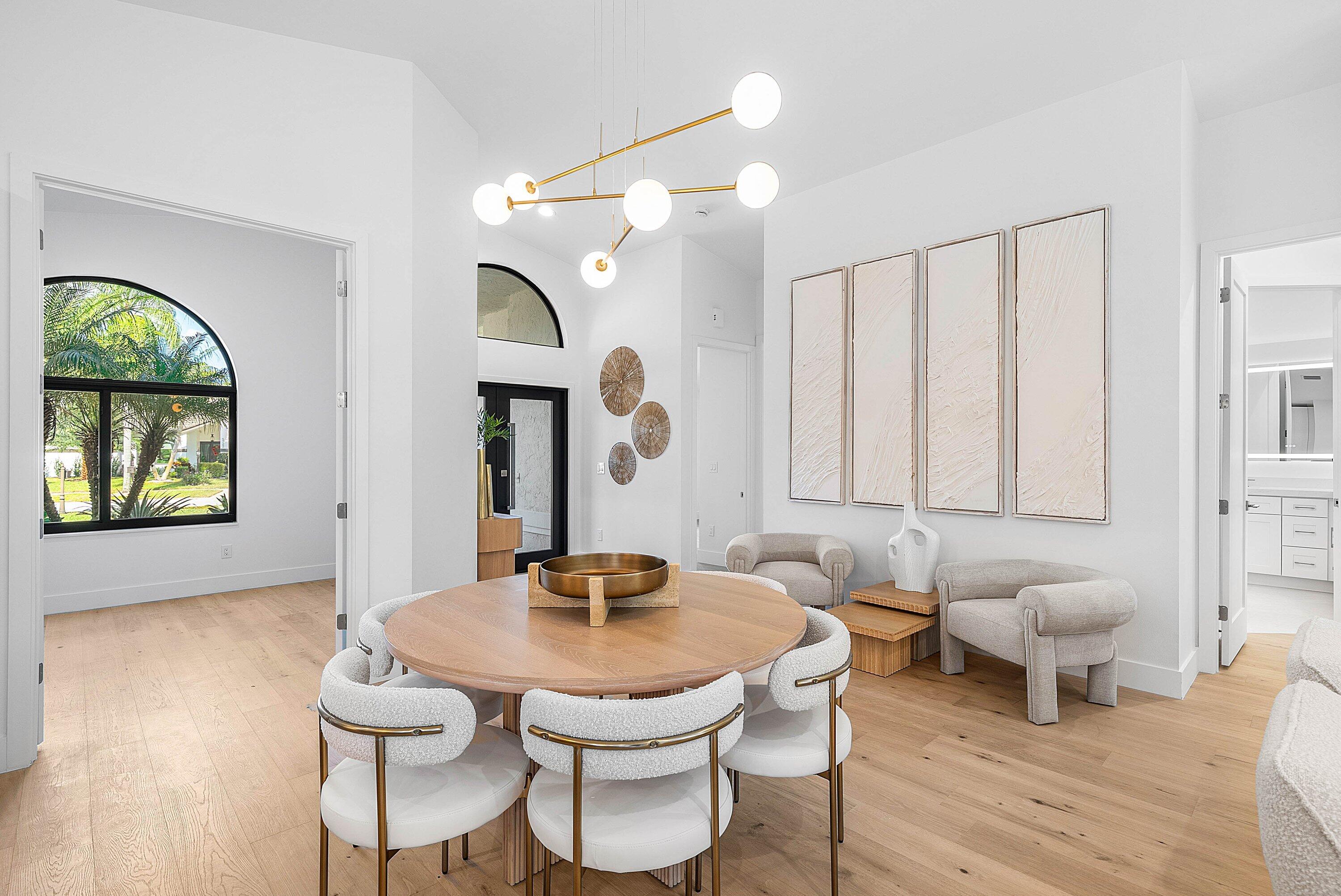 5723 Aspen Ridge Circle Delray Beach, FL 33484 - Photo 7 of 47 a living room with furniture a window and a table